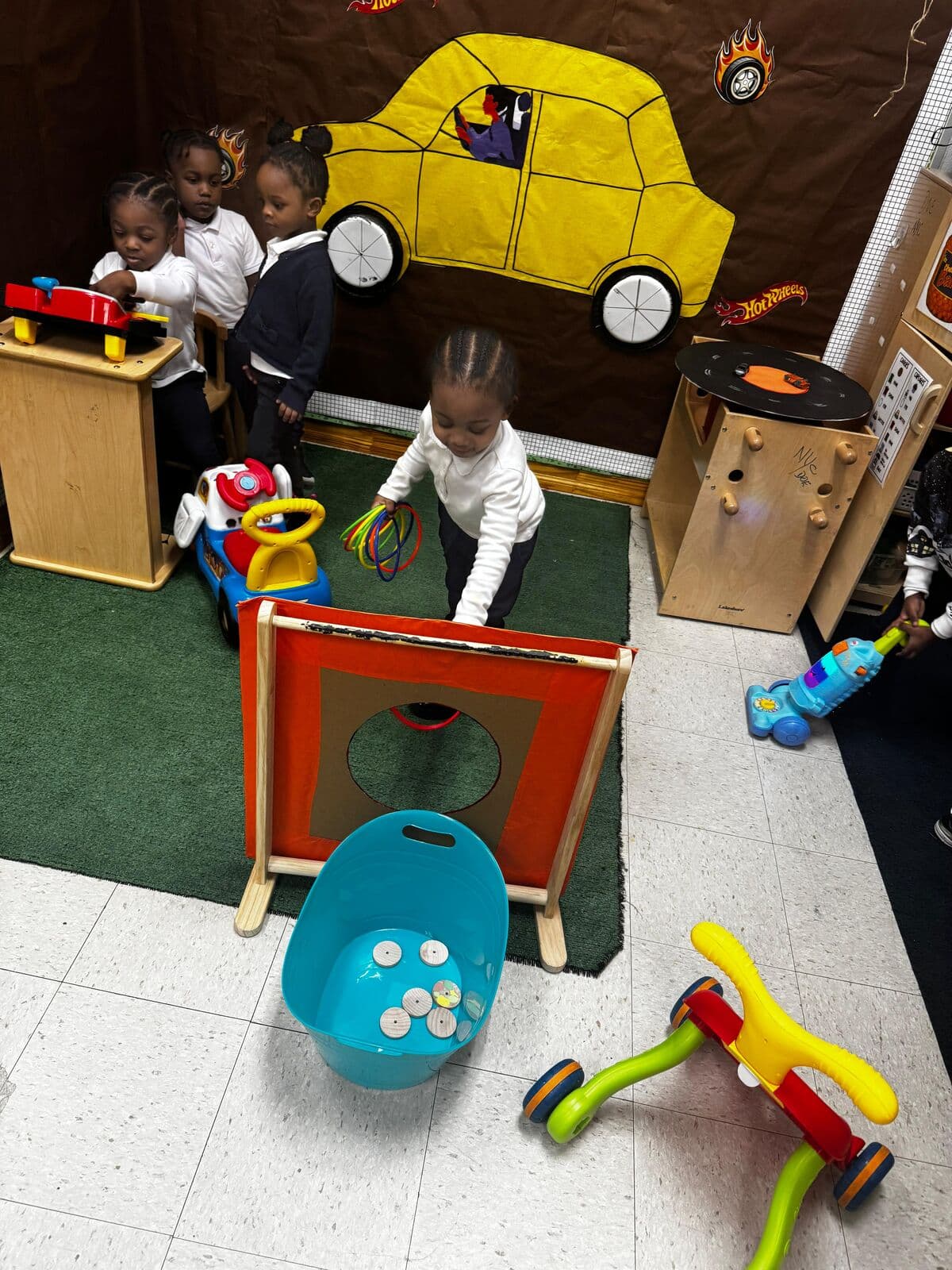 Toddlers engaged in centers-based play activities at Einstein Daycare